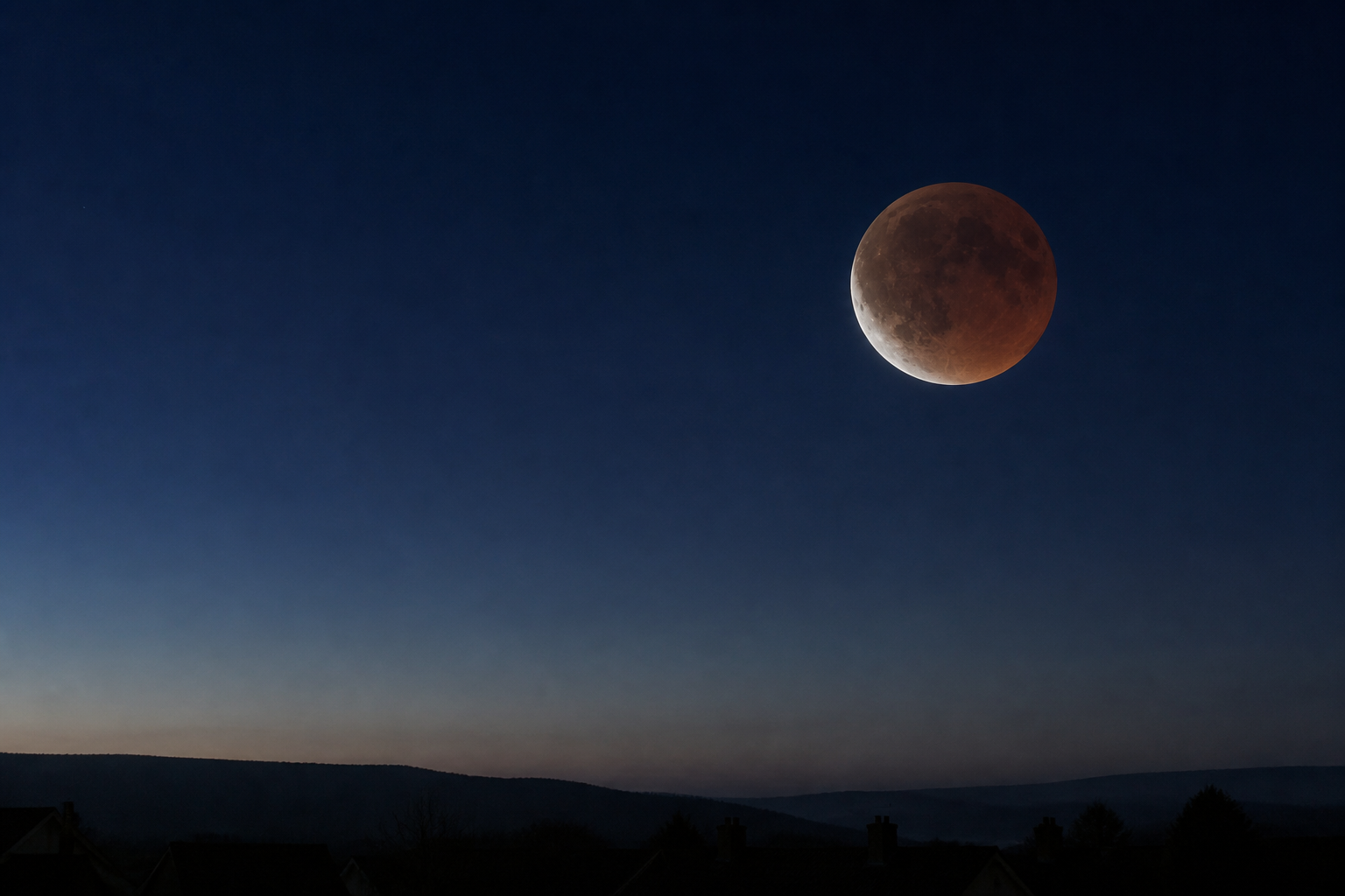 Conceptual pre-dawn view of a deeply eclipsed copper-coloured Moon low above a dark British countryside and rooftop horizon.